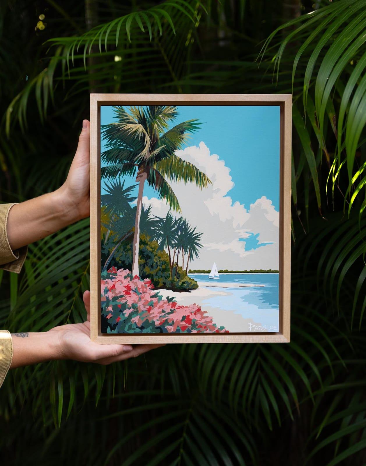 Framed original painting of a palm-lined beach with a sailboat on the water
